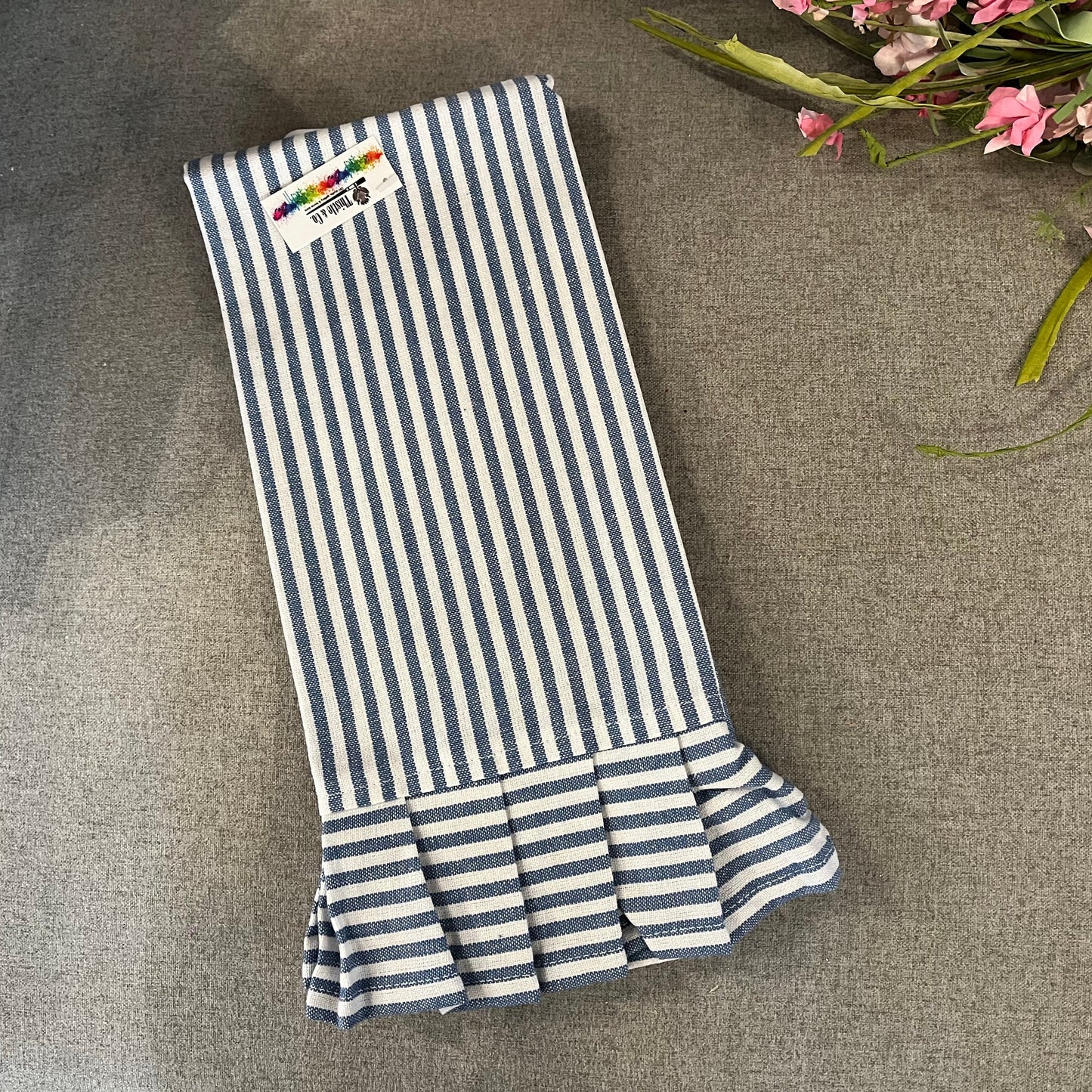 Blue and white ruffled towel