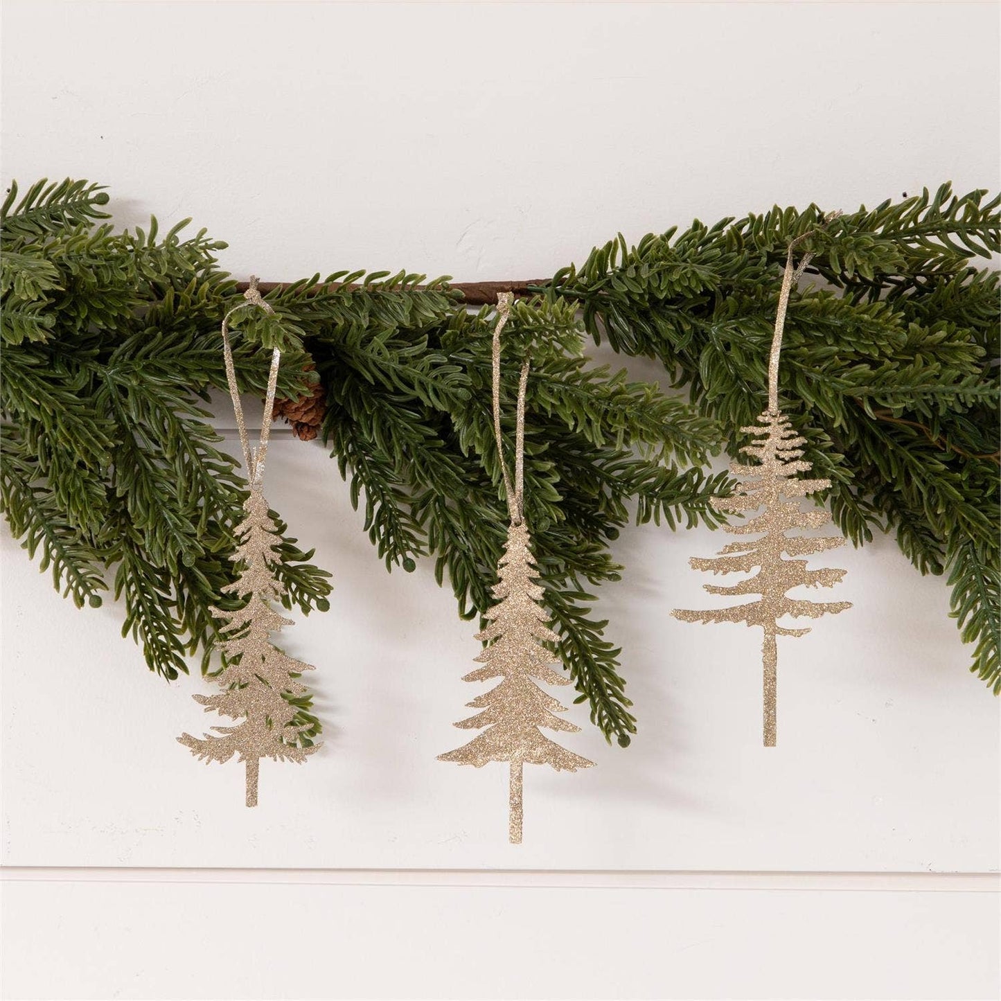 Glittery champagne pine tree ornaments