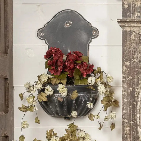 Black wall mounted urn sconce available in two sizes