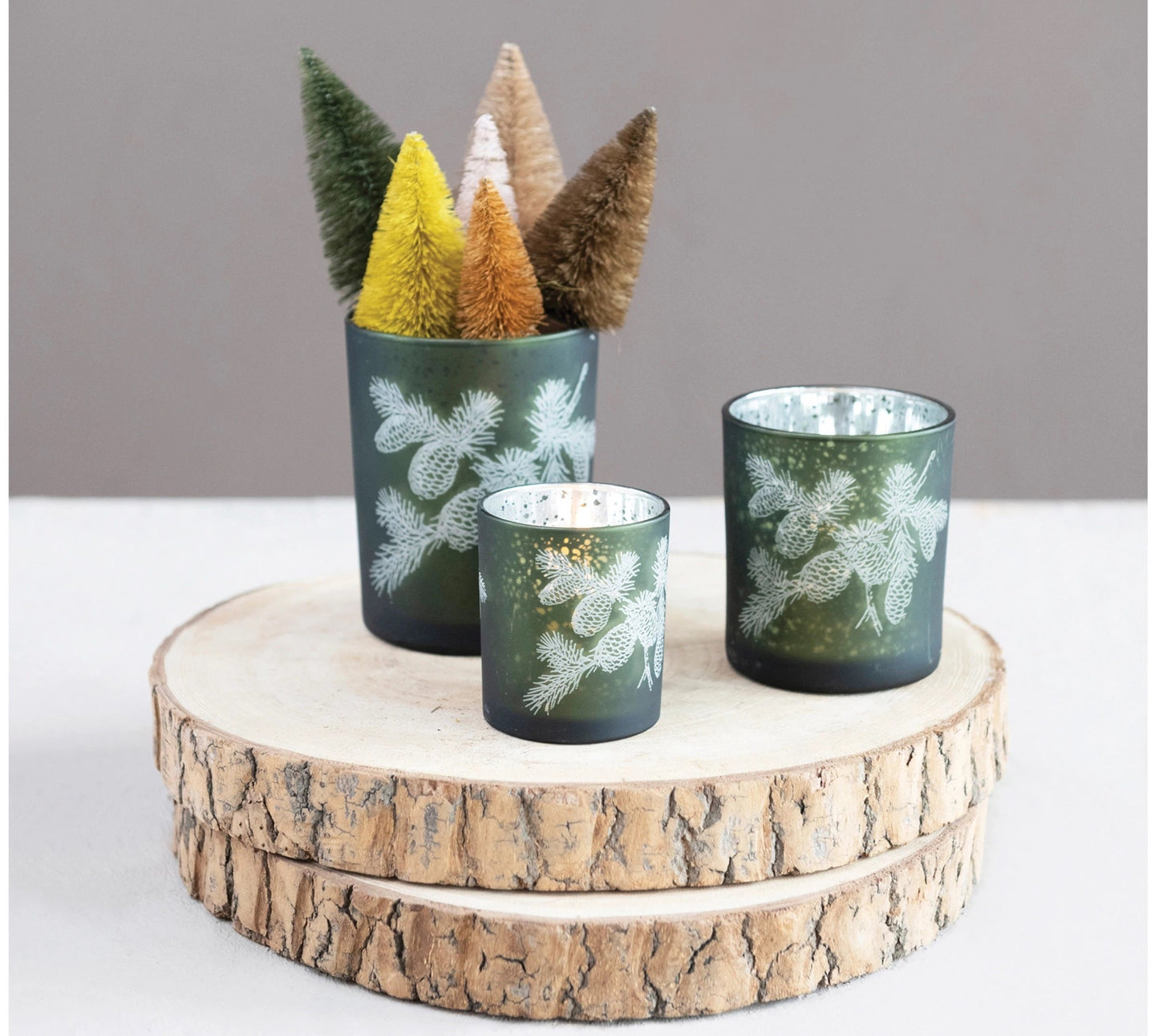 Green Mercury glass votive holder with etched pinecones