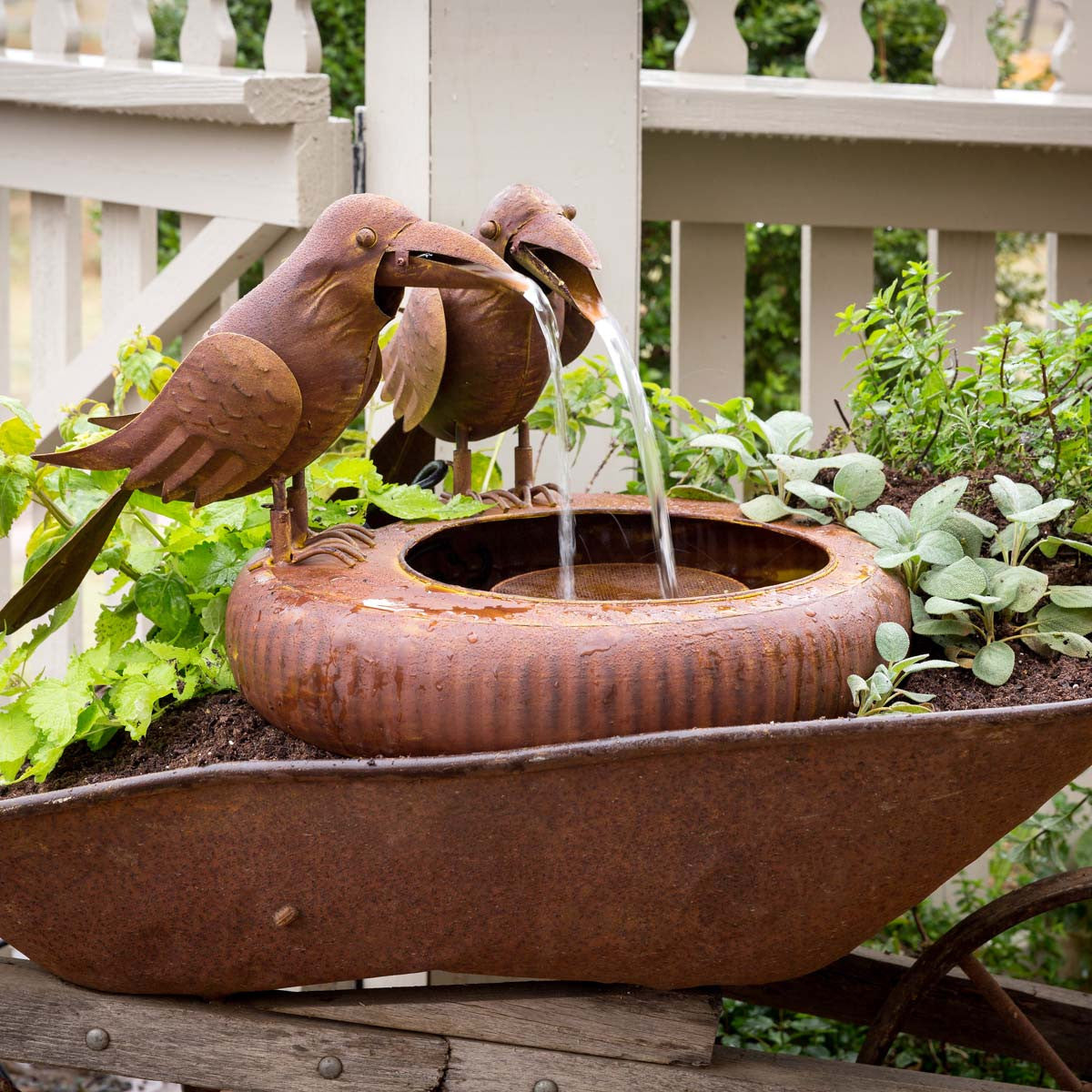 folk art crows fountain